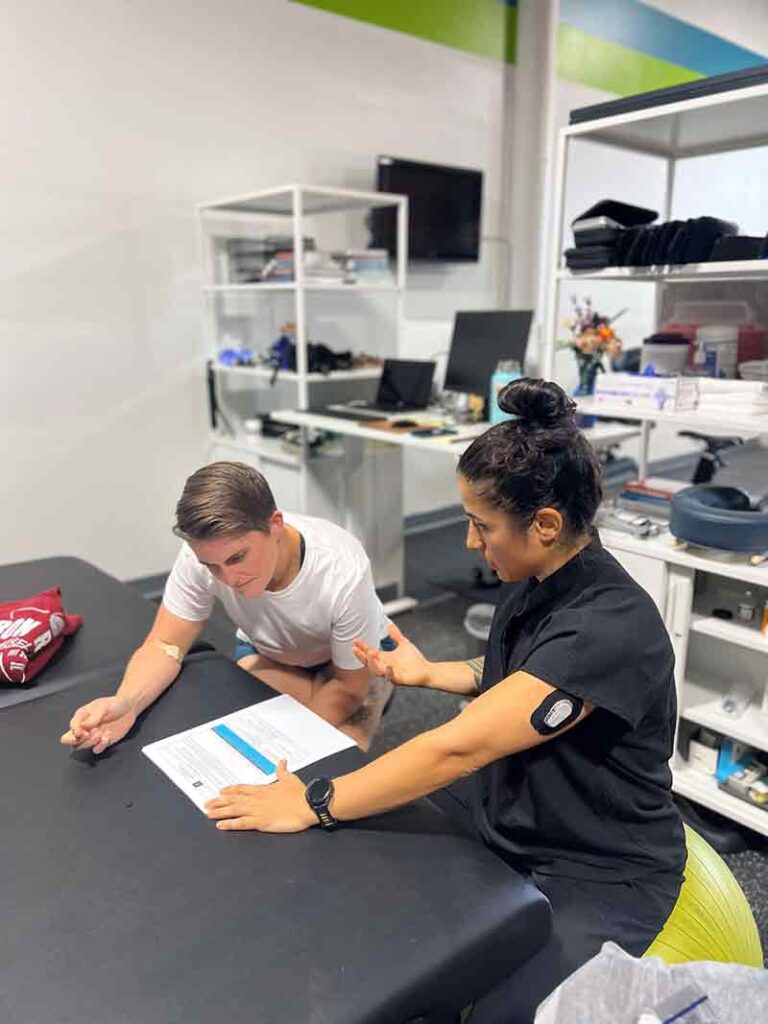 Dr Falconi reviewing lab report with patient for a comprehensive lab analysis