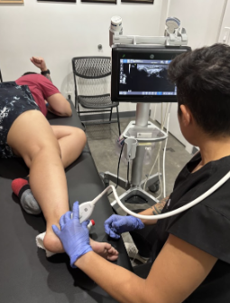 Physician performing diagnostic ultrasound for Ankle and plantar fascia pain in Tacoma